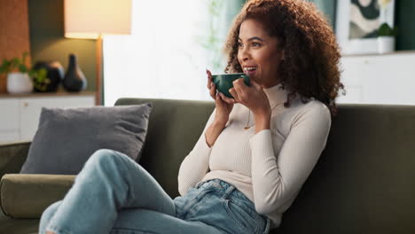woman relaxing on couch with coffee