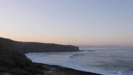 empty beach in ericeira in the morning