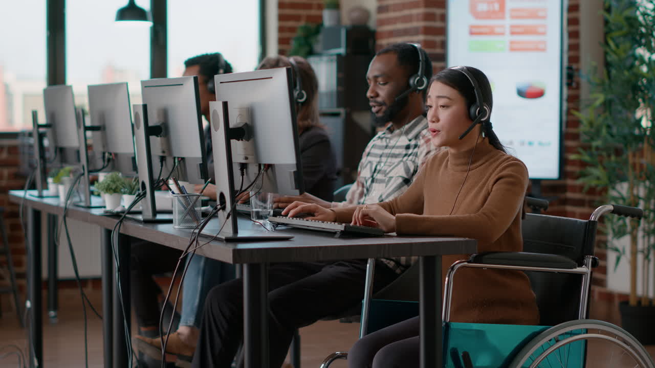 Asian woman with disability using headset to help clients