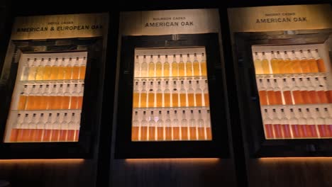 display of whiskey hues in oak barrels