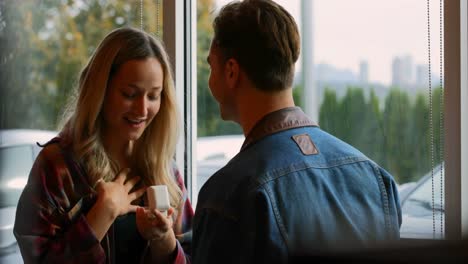 young couple interacting with each other in cafe 4k