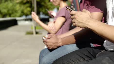 closeup shot of people using digital devices on street