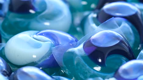 background of colorful capsules with washing powder for washing dishes of the dishwasher