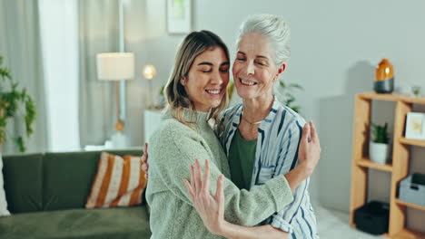 Love,-hug-and-woman-with-senior-mother-in-a-living