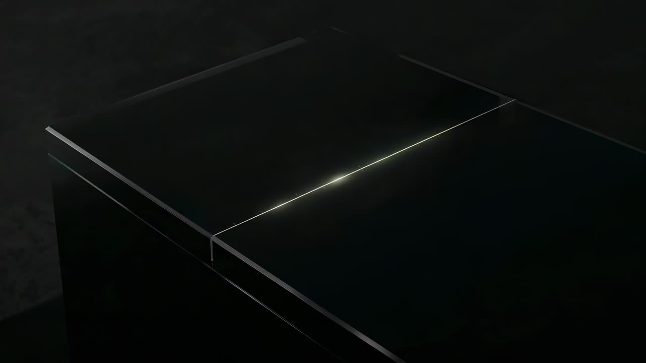 Igniting L-shaped tip starting matte black block top-edge and diagonal beams glowing in studio