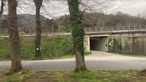 Stable-moving-shot-of-empty-streets-during-covid-times-in-Italy-autumn-dry-trees