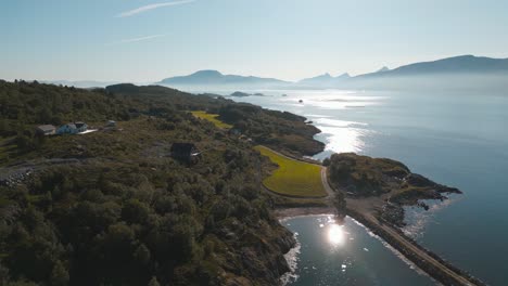 Fjord-landscape-with-island-on-fjord-waters,-shot-under-bright-summer-light-at-Leka-island,-Norway