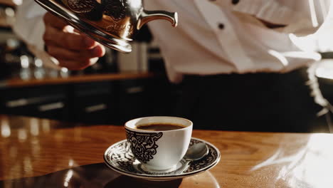 pouring arabic coffee