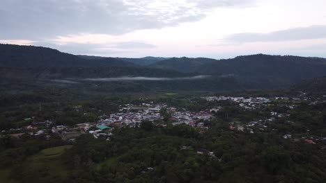 Aerial View of a Village Nestled in the Mountains