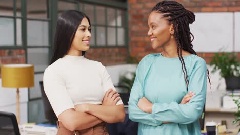 portrait of happy diverse female business colleagues at office