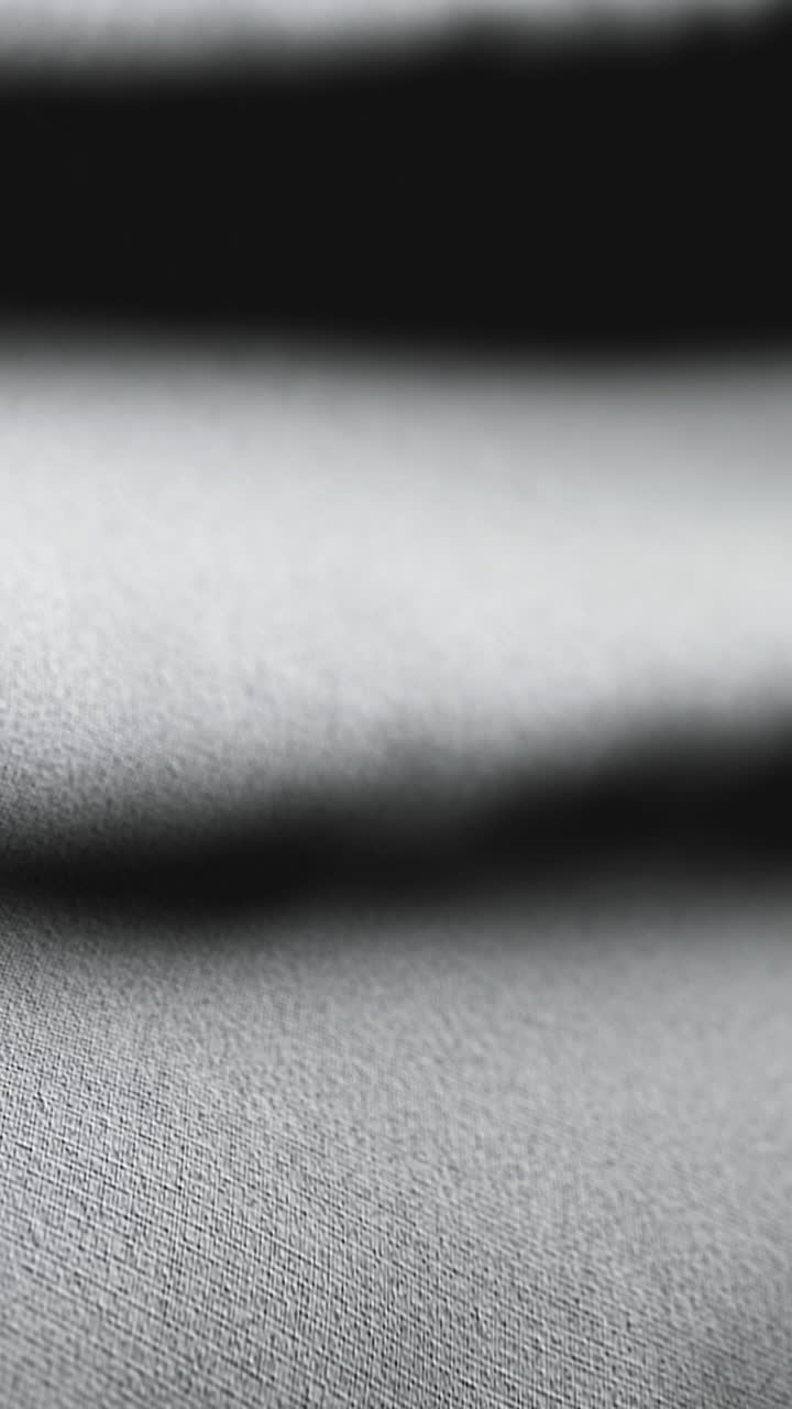 Neutral toned fabric background smooth motion loop