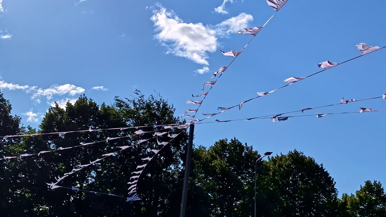Festive bunting flags decorate Riga streets, bringing color and joy to the city festival