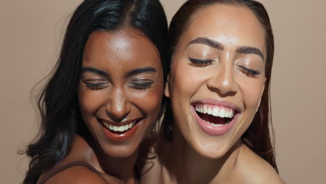 two smiling women with diverse skin tones