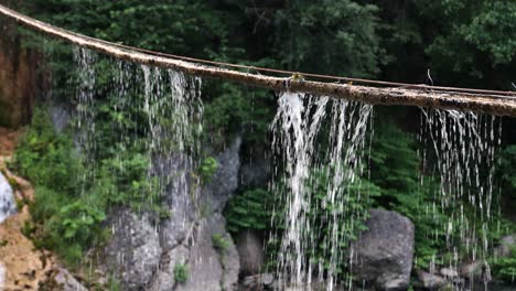 Water-Drops-At-The-Rope-Hanging-At-Sipote-Waterfall-In-Salciua-Commune,-Alba-County,-Romania