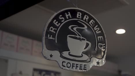 fresh brewed coffee sign panning in slow motion.