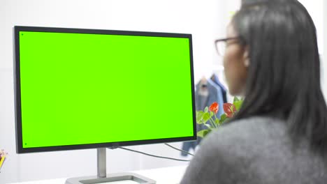 woman working at computer chroma screen