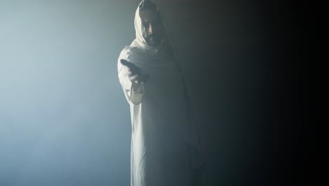 jesus christ in glowing, ambient, light offering his hand for salvation, forgiveness. cinematic visual representation of easter resurrection, the gospel, and god's love and forgiveness.