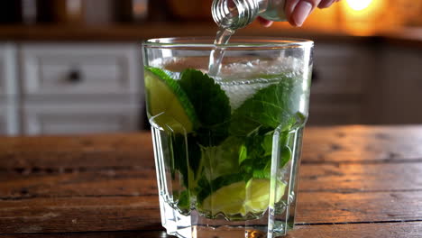 preparing a refreshing mint and lime drink