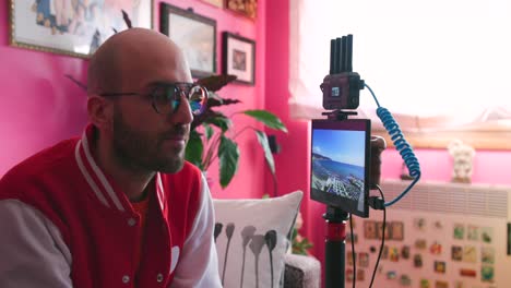 filmmaker checking his monitor which connected to his camera gear via wireless transmission system