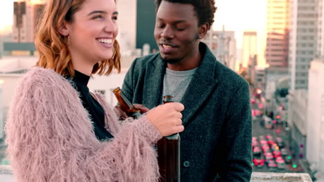 Happy,-couple-and-sunset-on-rooftop-with-beer