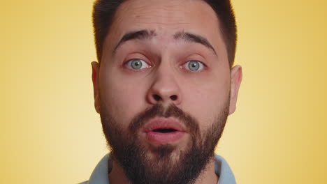 Excited amazed man surprise looking at camera with big eyes shocked by sudden victory wow emotion