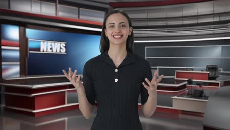 happy indian female anchor delivering the news on tv