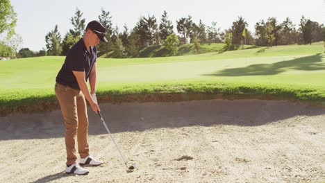 Video-of-caucasian-man-playing-golf-on-golf-field