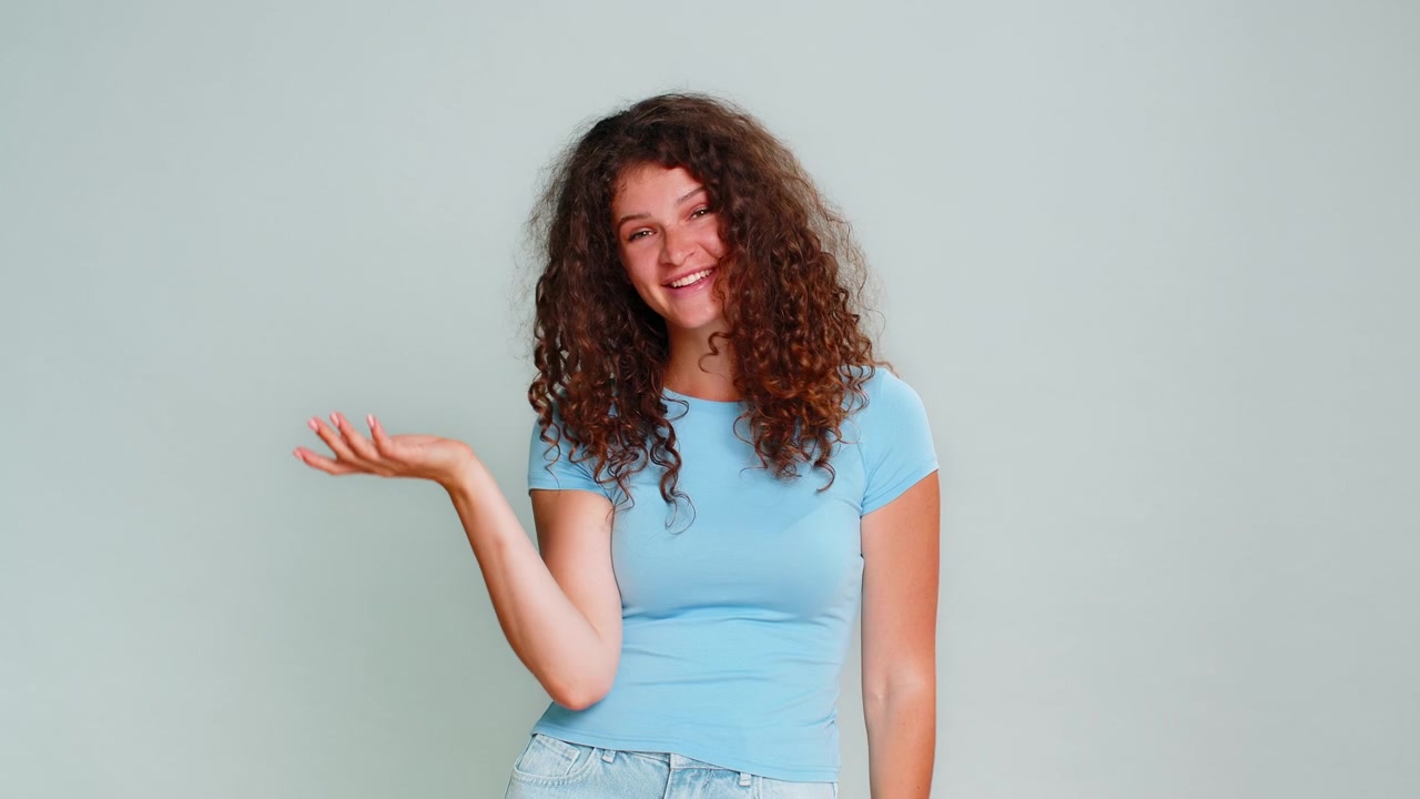 Woman making facepalm gesture laughing humorous reaction embarrassed funny silly mistake moment