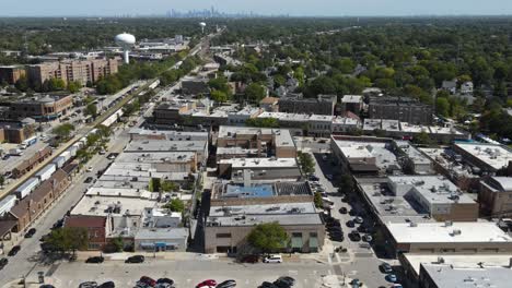 la grange, il on a sunny fall day, showcasing streets, buildings, and the suburban landscape with train and downtown chicago in background. crane down zoom day e