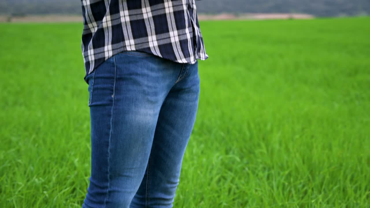 Agronomist Using a Tablet in an Agricultural Field. High quality 4k footage