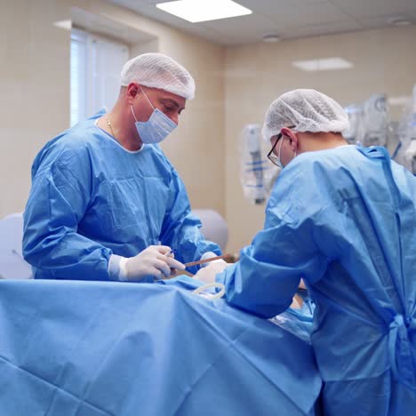 specialists and assistants during operation. medical team performing surgery in modern operating room. healthcare concept.