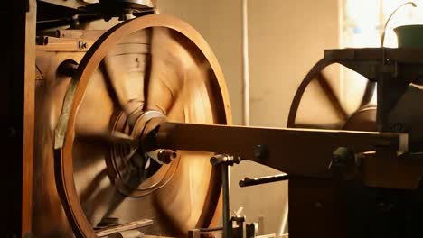 close-up of a vintage wooden machine wheel