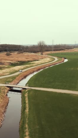 rural dutch landscape with road and canal