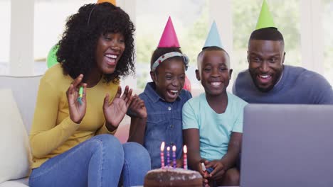 African-american-family-having-a-videocall-on-laptop
