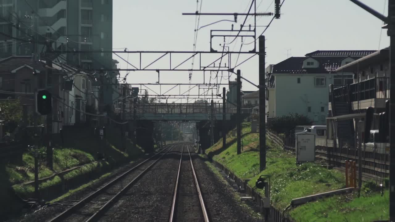 Rear View Inside A Moving Train On The Track In Tokyo, Japan - POV - timelapse