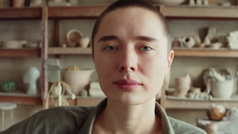 portrait of female potter in workshop