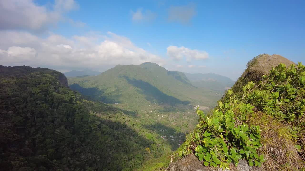 From the highest peak of a mountain the stunning colors of  the pristine natural landscape that stretches out as far as the eye can see