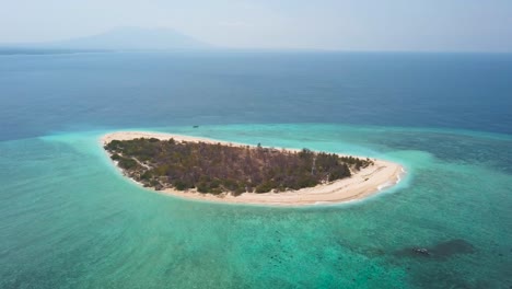 Drone-shot-orbiting-around-the-remote-Java-Island-of-Tabuhan-near-Bali-Indonesia