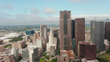 Panning-aerial-view-of-cityscape.-Drone-flying-around-tall-modern-skyscrapers-downtown.-Dallas,-Texas,-US