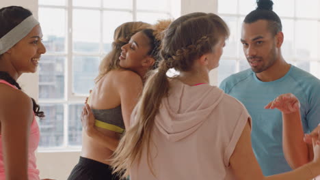 dance-class-happy-group-of-dancers-high-five-enjoying-successful-routine-resting-after-intense--training-practice-celebrating-achievement-in-studio