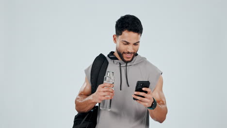 Fitness,-winner-and-man-with-phone-in-studio