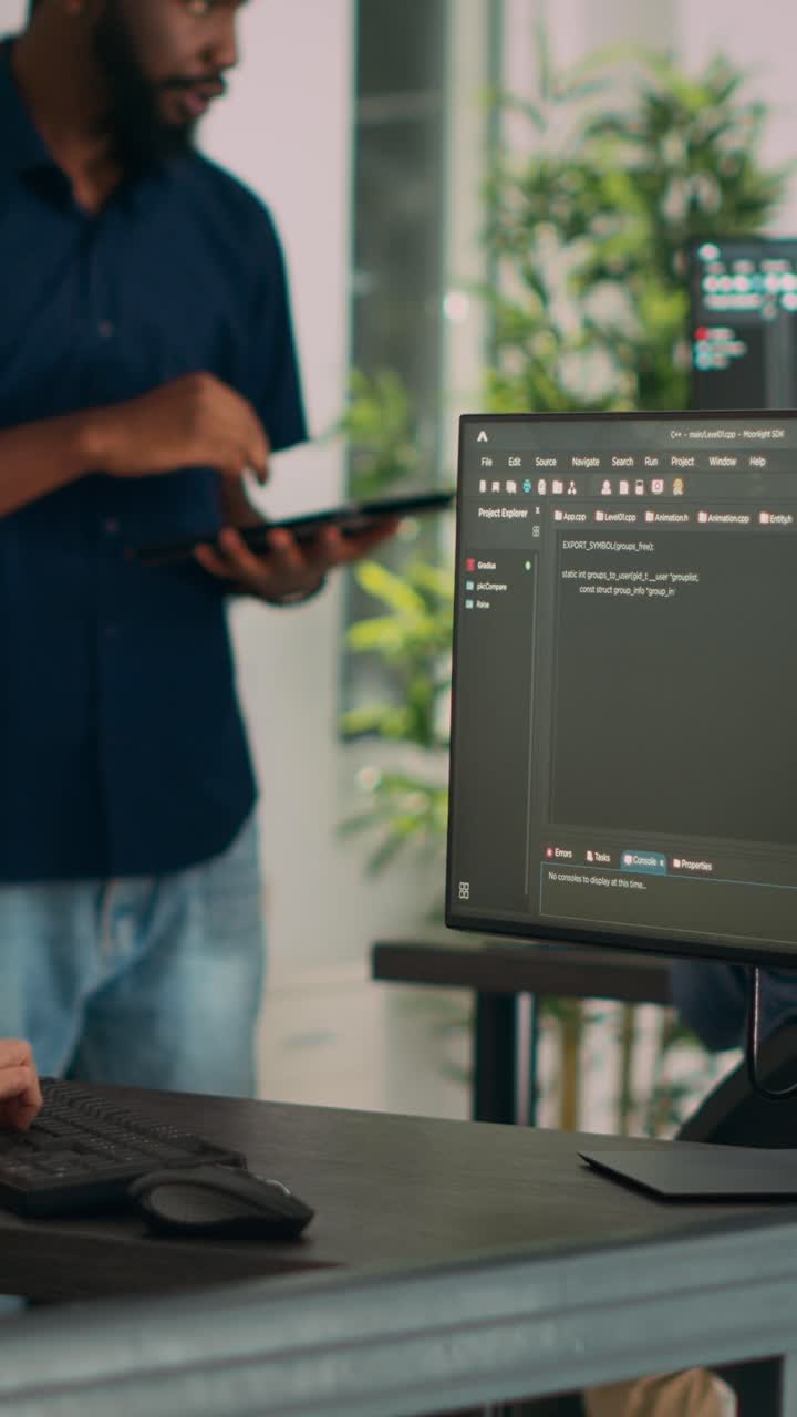 Vertical video: Asian programer typing big data code on computer to work on app developing program