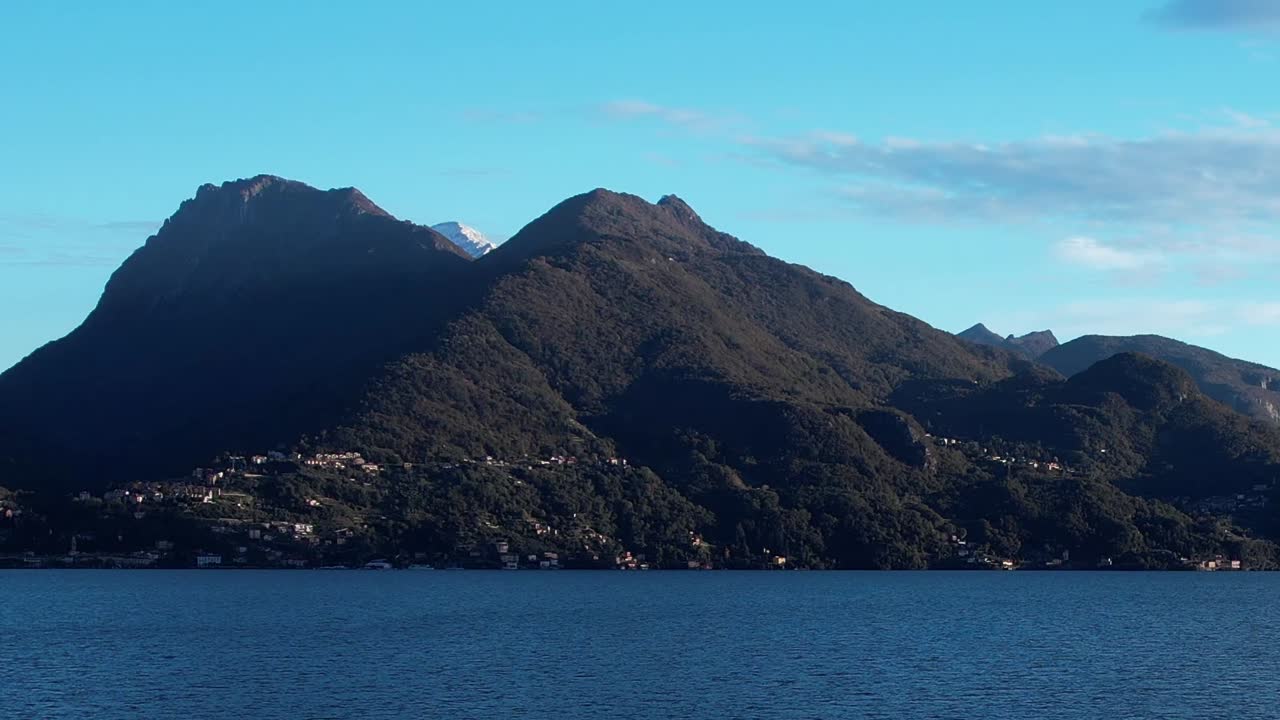 Breathtaking aerial view of the Italian Alps near a serene lake