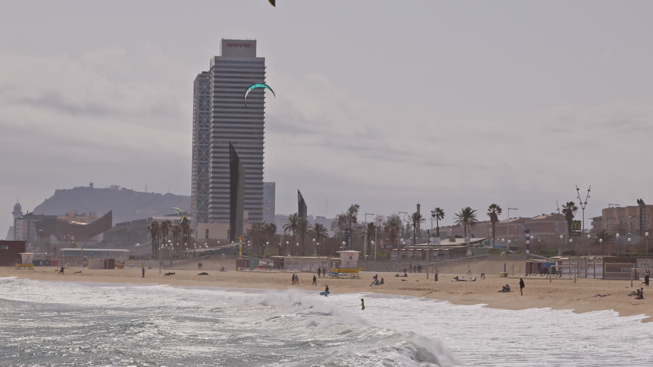 Kitesurfers on a windy day at sea in barcelona