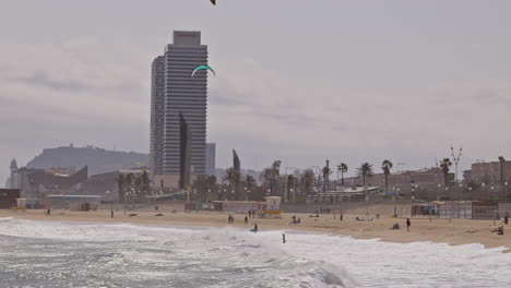 kitesurfers on a windy day at sea in barcelona