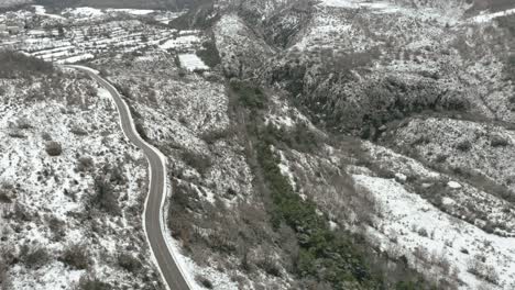 cars drive mountain road tilt up to reveal verdon gorge landscape, france aerial