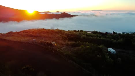 sunrise over hills. the clouds low in the valley, as the son rises it create a beautiful image, son breaking through the cloud