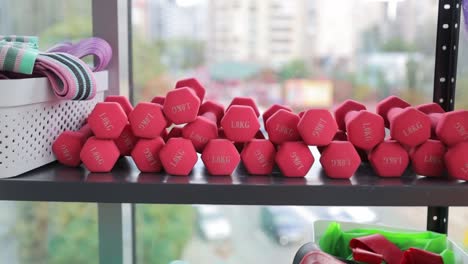view of red dumbbells, gym. sport and healthy lifestyle concept