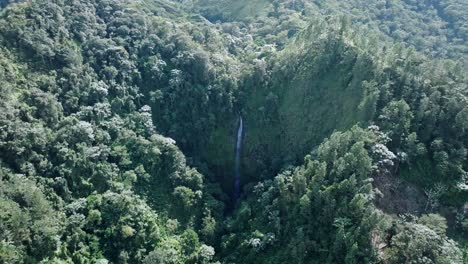 waterfall falling into the jungle in the salto del rodeo region of bonao_aerial shot