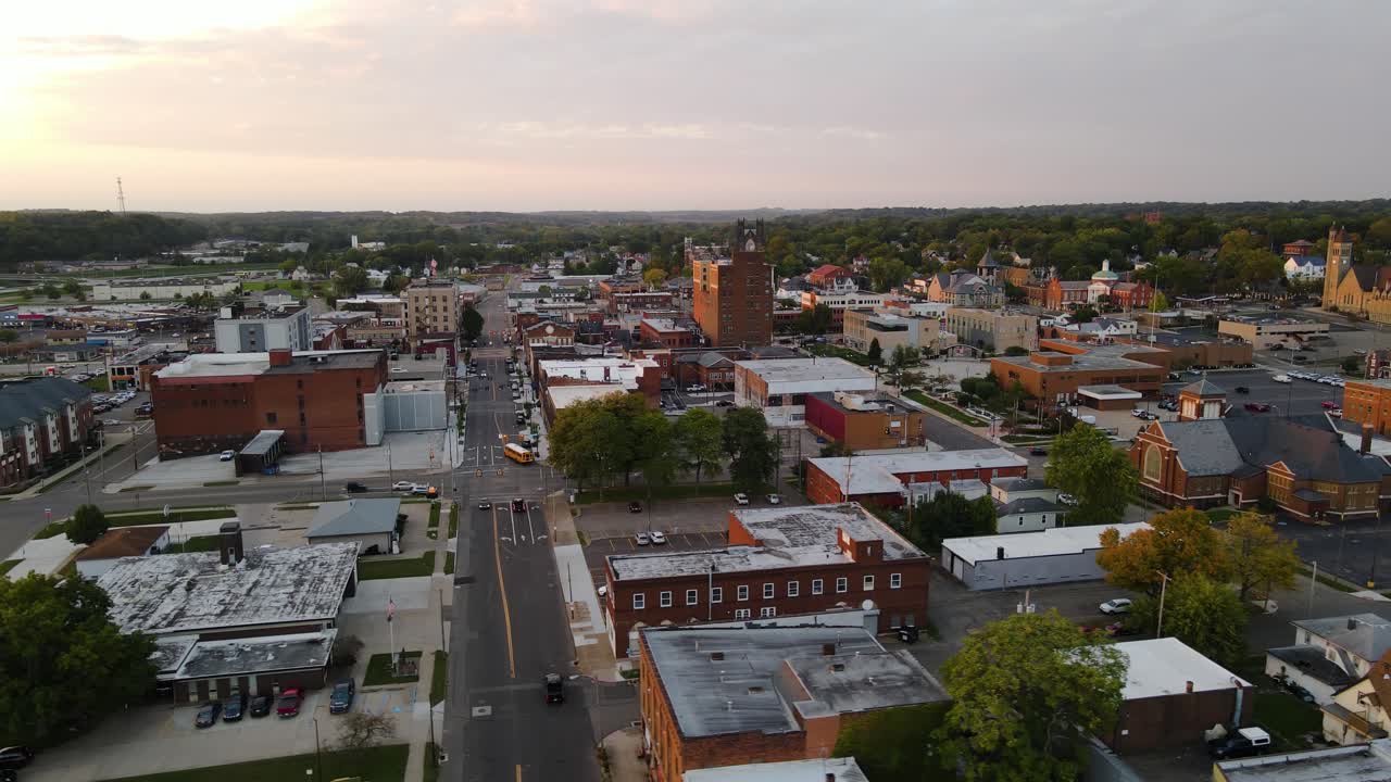 Aerial view of downtown Massillon, Ohio at sunset featuring historic buildings and streets. Orbit Left Sunset N